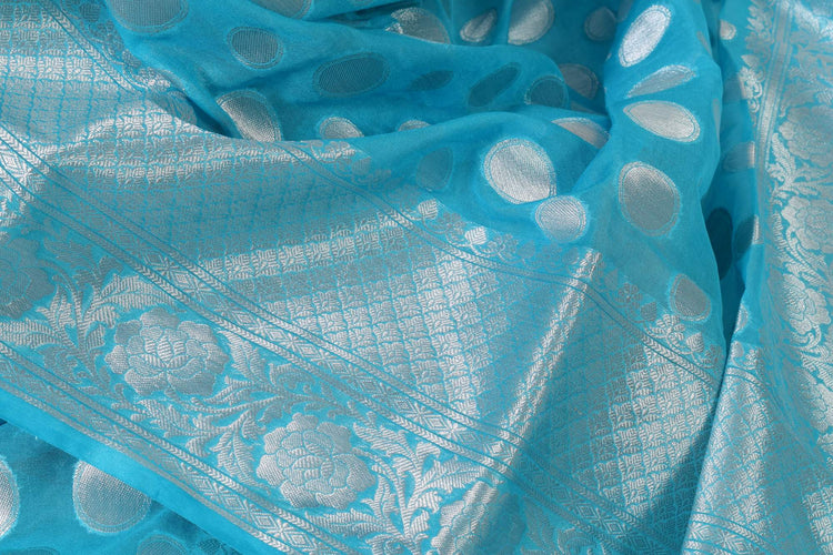 Turquoise Blue Banarasi Semi Georgette Soft Silk Silver Zari Woven Broad Floral